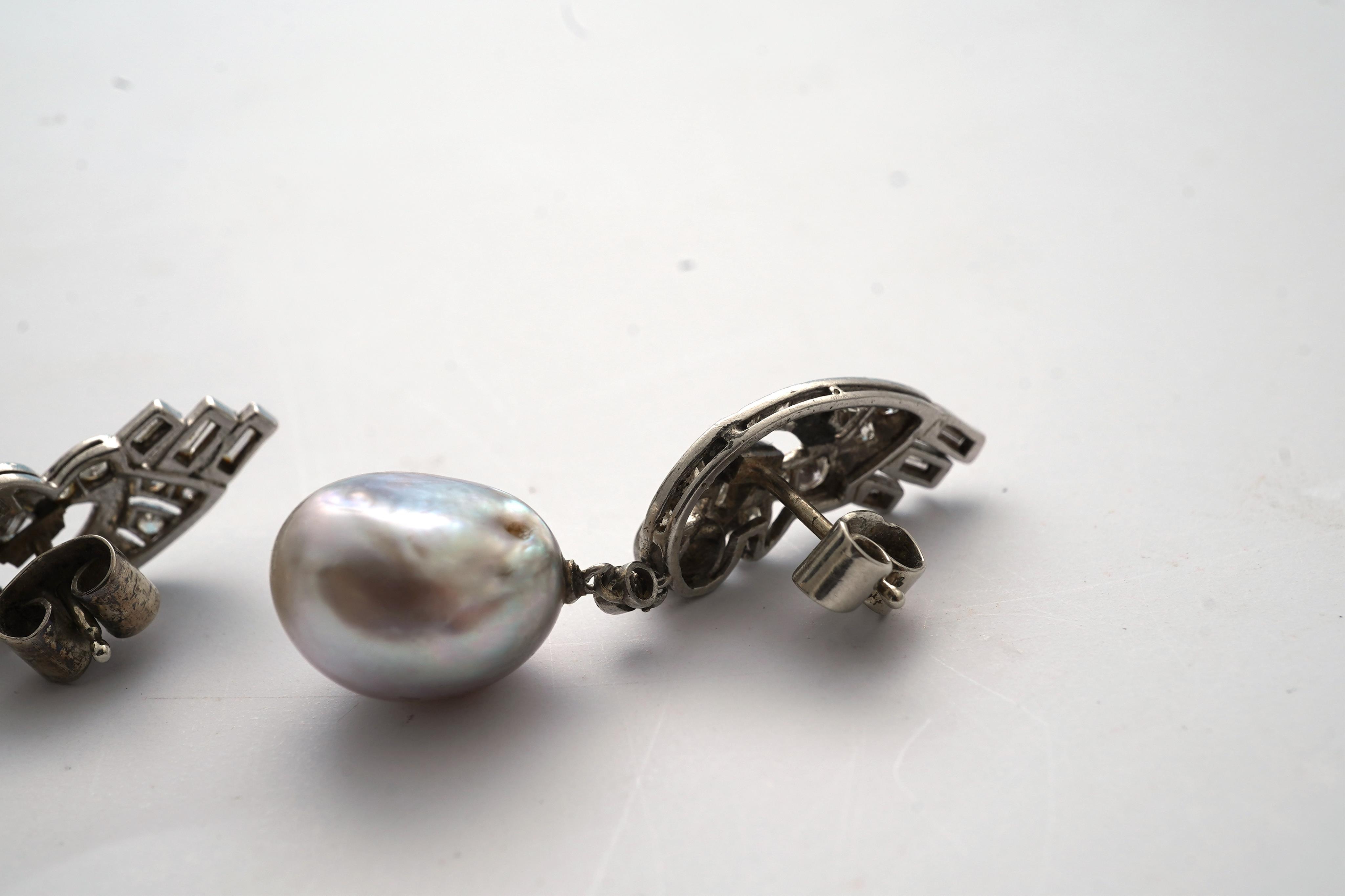 A fine pair of Art Deco natural pearl and diamond earrings, 1930s